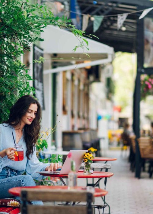 woman-sitting-in-a-street-cafe-and-drinking-cold-b-2025-04-01-13-21-36-utc (1)